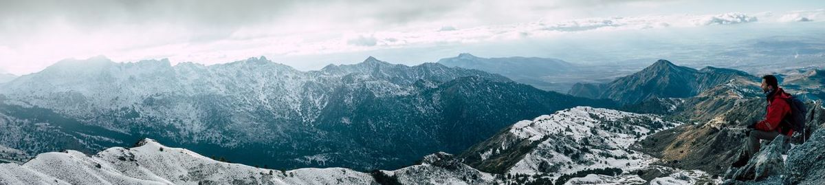 Panoramic view of snowcapped mountains against sky