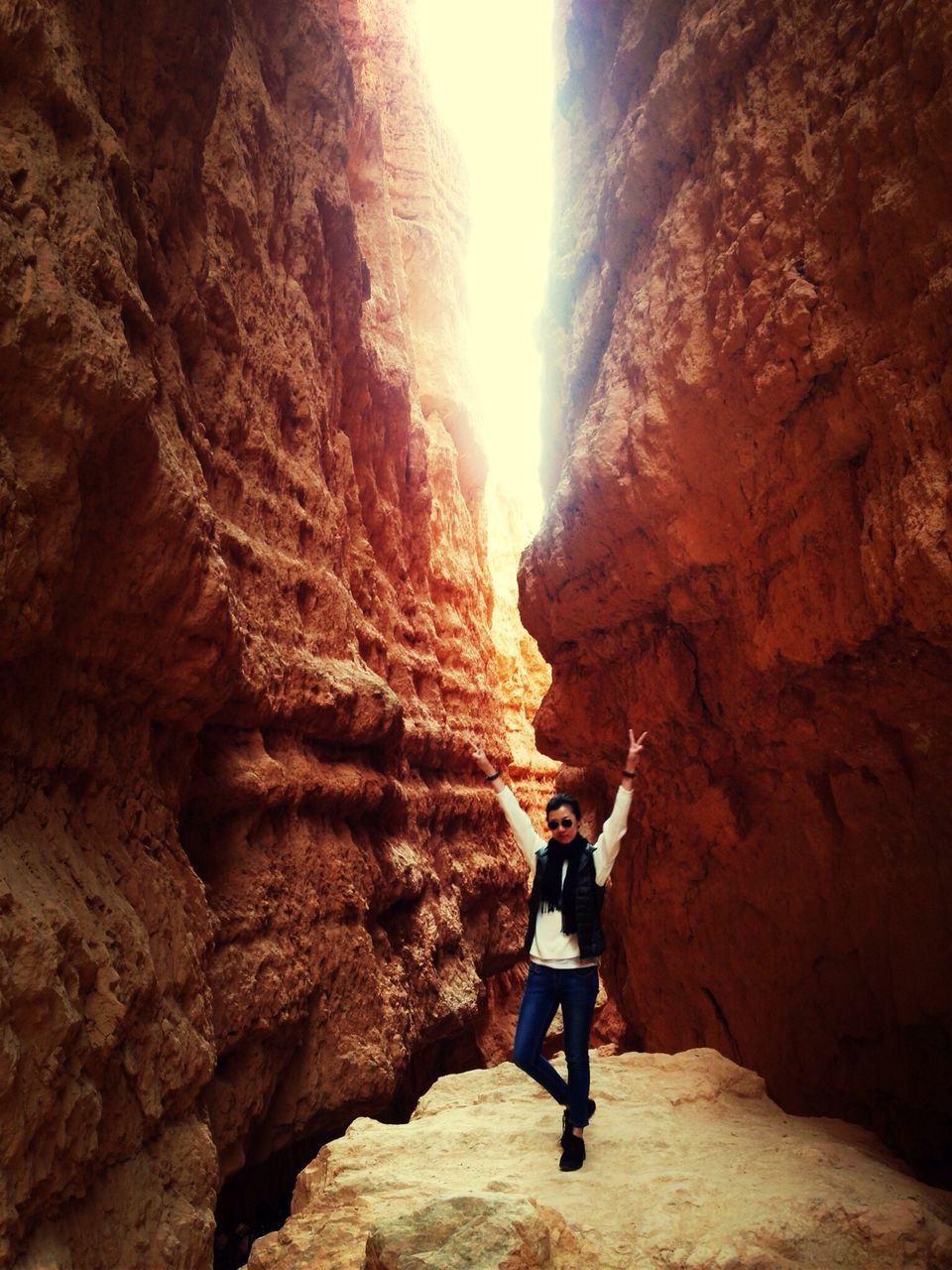 lifestyles, full length, leisure activity, rock formation, rock - object, rear view, men, mountain, tourist, standing, travel, casual clothing, person, backpack, tourism, walking, hiking, cliff