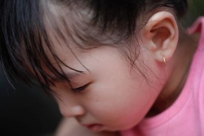 Close-up portrait of cute girl with eyes closed