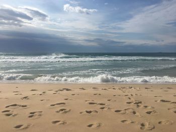 Scenic view of beach against sky