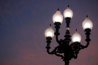 Low angle view of street light against sky at night