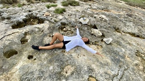 High angle view of woman on rock