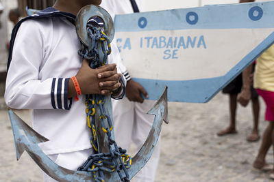 Men, women and children, members of the cultural group chegança dos marujos, 