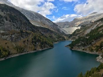 Scenic view of lake against cloudy sky