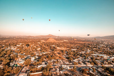 Aerial view of city against clear sky