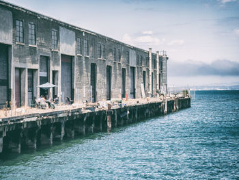 Pier over sea against sky