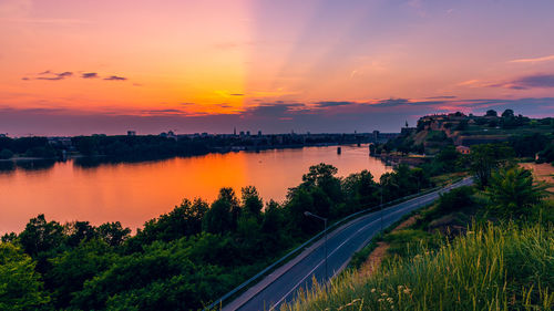 Scenic view of lake against sky during sunset