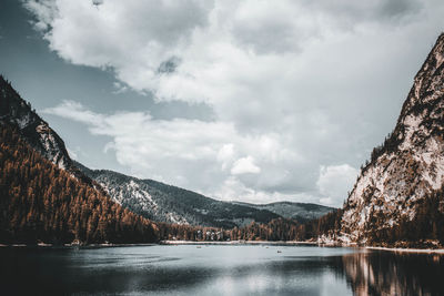 Scenic view of lake and mountains against sky