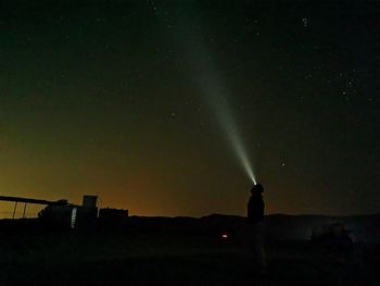 Scenic view of field against sky at night