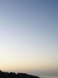 Scenic view of silhouette landscape against clear sky