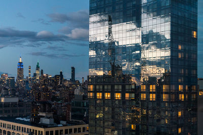 Modern buildings in city against sky