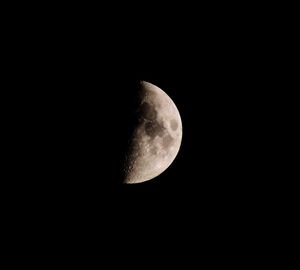 Low angle view of moon against sky at night