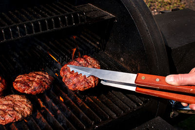 High angle view of meat on barbecue grill