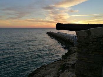 Scenic view of sea against dramatic sky