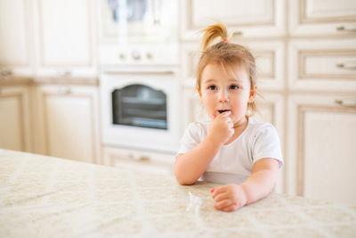 Portrait of cute baby at home