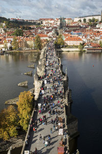 High angle view of crowd by river in city