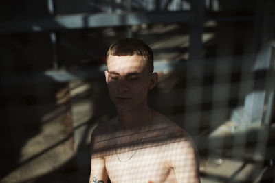 Portrait of young man looking away