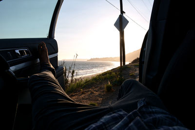 Man relaxing on car window