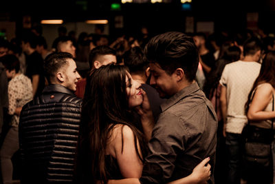 Young couple standing at music concert