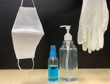 Close-up of glass bottle on table at home