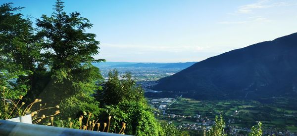 Scenic view of sea and mountains against sky