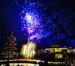 Low angle view of illuminated christmas tree at night