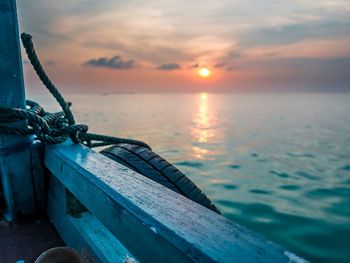 Scenic view of sea against sky during sunset seen from boat