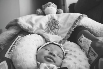 High angle view of baby sleeping on bed at home