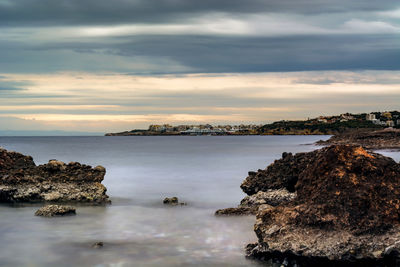 Scenic view of sea against dramatic sky