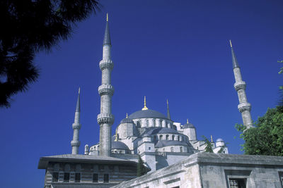 Low angle view of building against blue sky