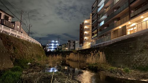 Reflection of illuminated buildings in canal at night