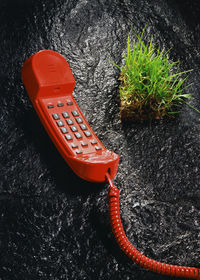 High angle view of telephone booth by water