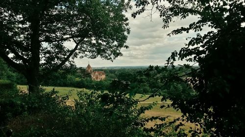 Scenic view of landscape against cloudy sky