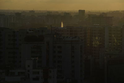 Cityscape against sky during sunset