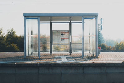 Exterior of building at a railway station against clear sky