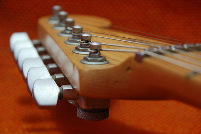 Close-up of guitar on table