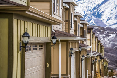 Building by street in city during winter