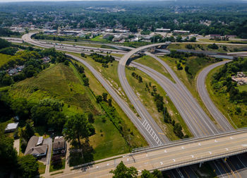 High angle view of highway amidst trees in city