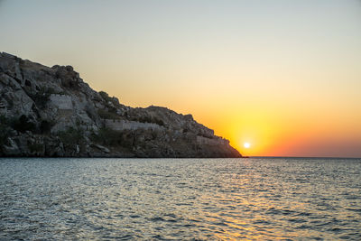 Scenic view of sea against clear sky during sunset