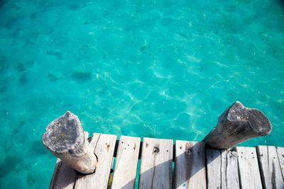 High angle view of pier by swimming pool