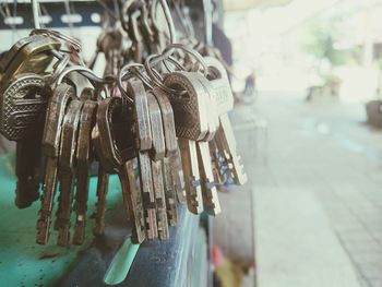 Close-up of padlocks hanging on metal