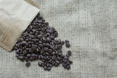 High angle view of coffee beans on burlap