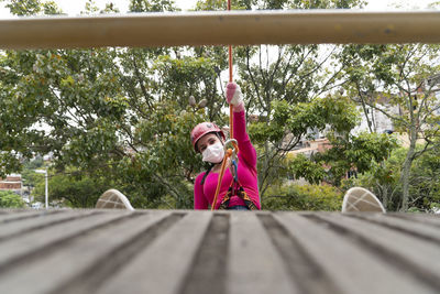 Female rappelist going down the rappel walkway. 