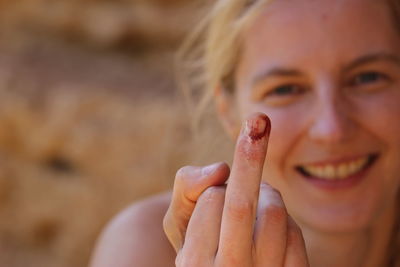 Close-up portrait of a smiling young woman