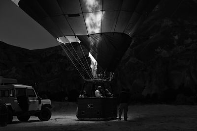 People in hot air balloon at night