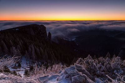 Scenic view of mountains against sky during winter