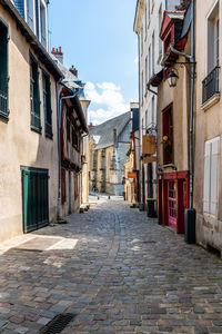 Narrow alley amidst houses in town