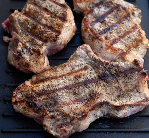 High angle view of meat on barbecue grill