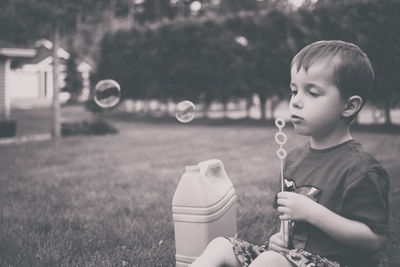 Little girl playing in grass