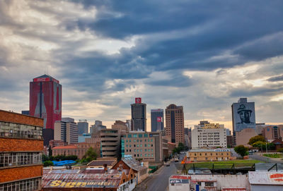 Modern buildings in city against sky